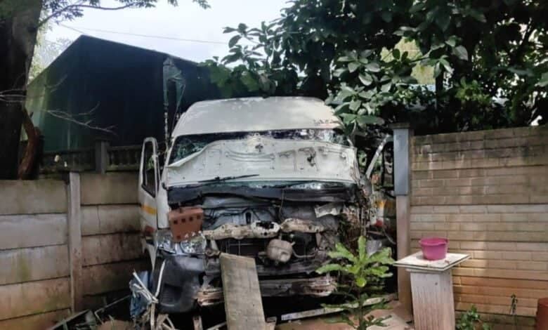 A taxi crash through a wall.