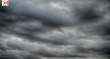 Dark grey clouds forming in the sky.