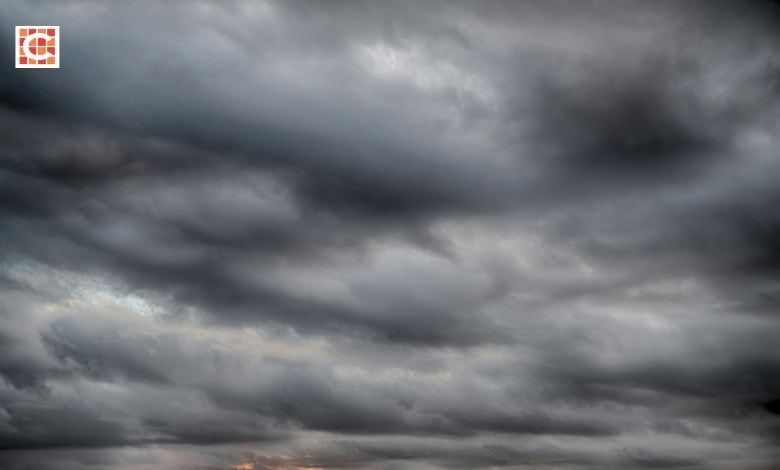 Dark grey clouds forming in the sky.