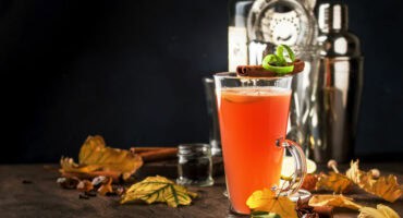 Hot buttered rum with apple juice, honey, and cinnamon