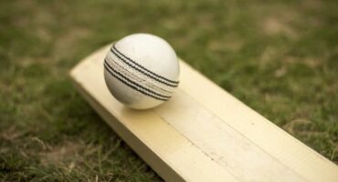 A cricket bat and ball.