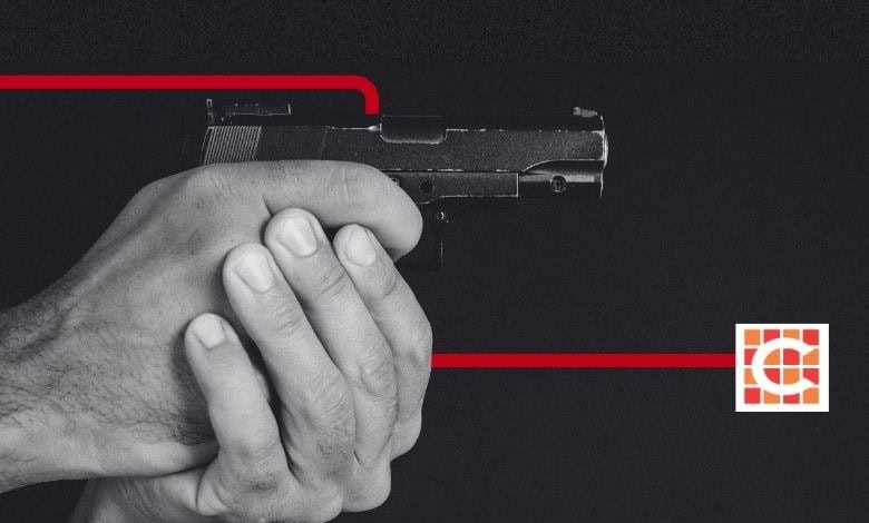 A man holding a firearm for illustration purposes only