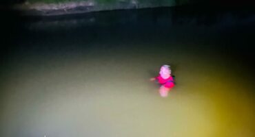 A police officer searches for a missing boy.