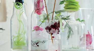 Pomegranate vodka cocktail with beetroot garnish