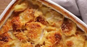 Hearty lentil and mushroom hotpot with a crisp potato topping is the perfect meat-free dinner, gently spiced with masala.