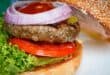 Flame-grilled ostrich burgers with classic toppings