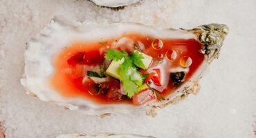 Festival-style oysters with tomato and chilli dressing