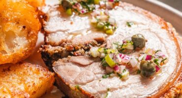 Rotisserie porchetta with crisp crackling and herby salsa
