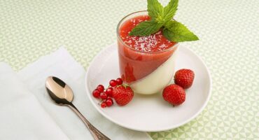 Strawberry and vanilla panna cotta with fresh berry layer