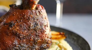 Slow-braised pork shank with red wine and creamy mash