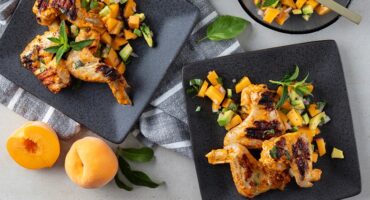 Fire-grilled spicy wings with peach and avo salsa