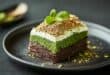 Pistachio and chocolate layer cake with cream topping