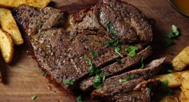 Air fryer rump steak and chips with garlic butter sauce