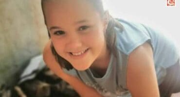 Close-up of young girl smiling at the camera