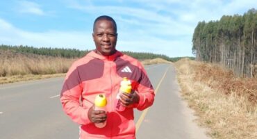Coach next to road.