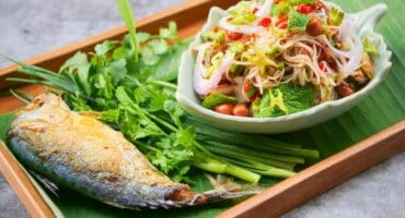 Thai rice vermicelli with fried mackerel and spicy herb salad