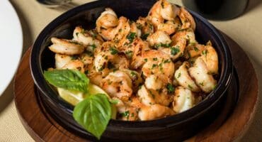 Garlic butter prawns with lemon and herbs recipe