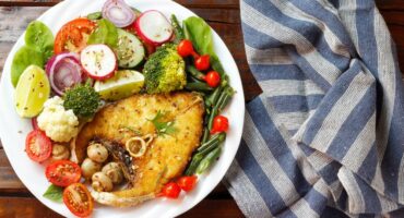 Grilled fish with crunchy garden salad makes a great keto dish