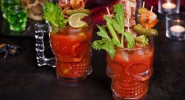 Bloody Mary loaded with bacon and shrimp skewers