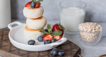 Cottage cheese pancakes with blueberries and strawberries