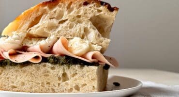 Pistachio pesto, ham and burrata focaccia sandwich