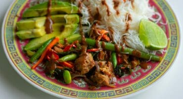 Pork and green bean stir-fry with peanut sauce and rice noodles