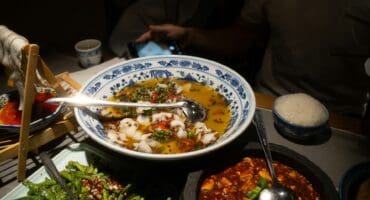 Spicy poached fish in a chilli garlic broth with sizzling chilli oil