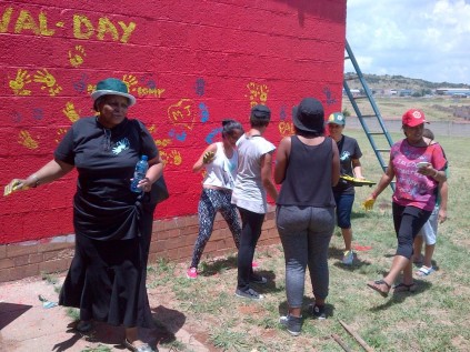 SABC sports presenters and fans painting the Ratanang Home.