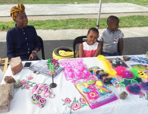 Omolemo Pule (middle) at her stall where she was selling her self made bracelets.