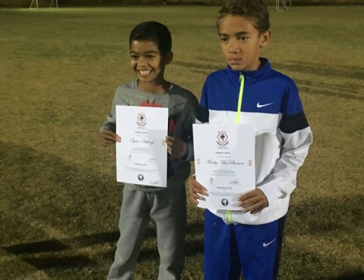 Mugammad-Yusuf MacPherson and a teammate receiving awards.