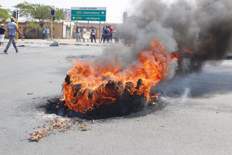 Aggravated community members close all roads in Meadowlands and burn tyres as they do not have electricity.