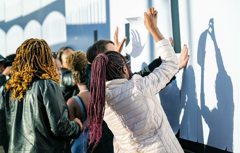 The interactive billboard at Melrose Arch lets people peel away barriers and access free credit education and prizes.
