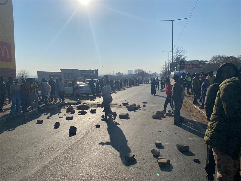 One driver was shot and killed and two others were rushed to hospital after their car was set alight.