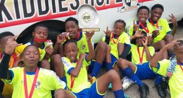 Kiddies Hope Academy crowned the Southern Central League Champions Description: Players in their sports gear with medals.