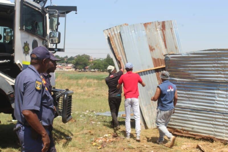 Frustrated residents vow not to move until the government addresses decades-long housing delays.