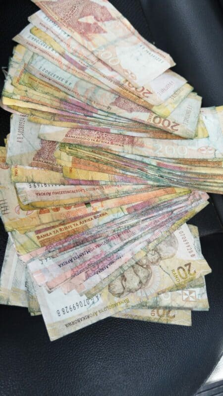 Both suspects face charges of possession of explosives and suspected stolen money.