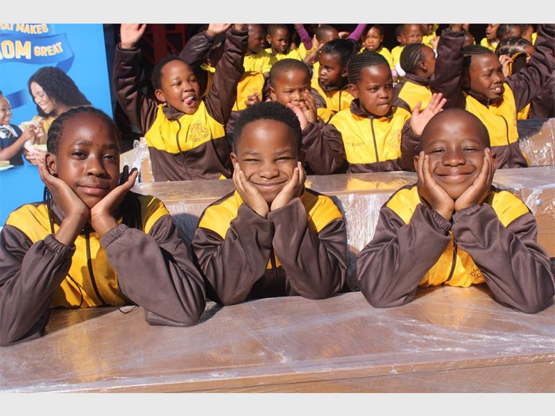 The school received 20 new desks from Blue Ribbon after learners won a 2024 recycling competition by collecting used bread plastic bags.
