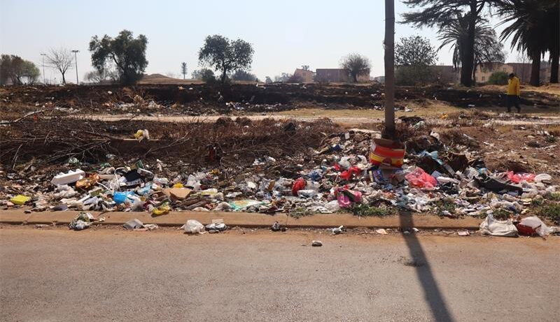 Former councillor Peter Rafferty joined residents in the community clean-up.