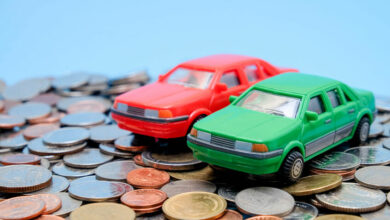 save money for investment concept Toy car and stack of coins