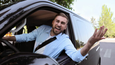 Emotional man in car. Aggressive driving behavior