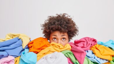 Wondered,Curly,Haired,Ethnic,Woman,Focused,Above,Surrounded,By,Multicolored