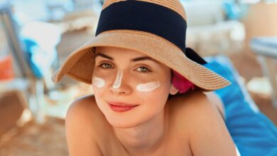 Woman,Smile,Applying,Sun,Cream,On,Face.,Skincare.,Body,Sun