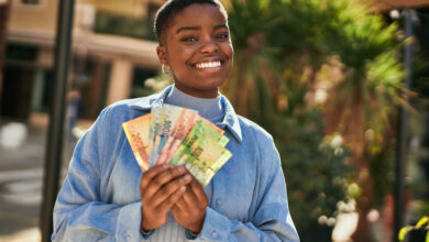 Young,African,American,Woman,Smiling,Happy,Holding,South,Africa,Rand