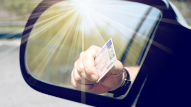 126522544 - a man shows his driver's license