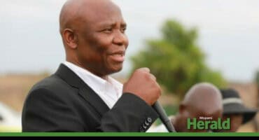 Ntsewa Mokobane speaks into a microphone.