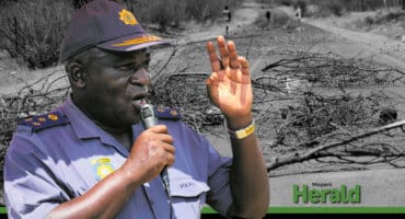 Brig Solomon Serakwana in the foreground with an image of the roads after the protests in the background.