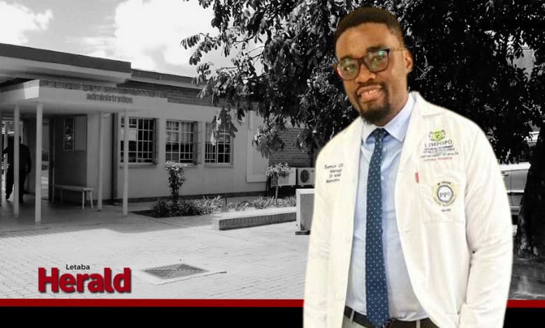 Dr Mikia Ramothwala in front of a background omage of Letaba Hospital.