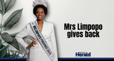 Mrs Limpopo 2025 poses in a white suit with her crown.