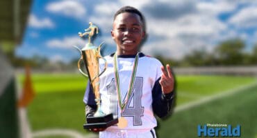 Travis Mokgalabone holds his trophy proudly.