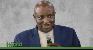 Audit committee chairman Kenneth Mhlongo presents the audit report.